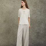 Famecoco Wide‑Leg Pants with Button Detail