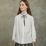 Famecoco Bow‑Tie Blouse with Balloon Sleeves