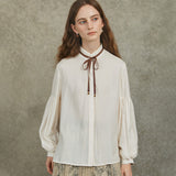 Famecoco Bow‑Tie Blouse with Balloon Sleeves