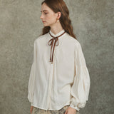 Famecoco Bow‑Tie Blouse with Balloon Sleeves