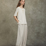 Famecoco Wide‑Leg Pants with Button Detail