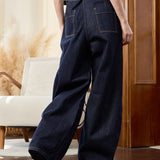 Famecoco Curved‑Leg Wide Raw Denim Pants